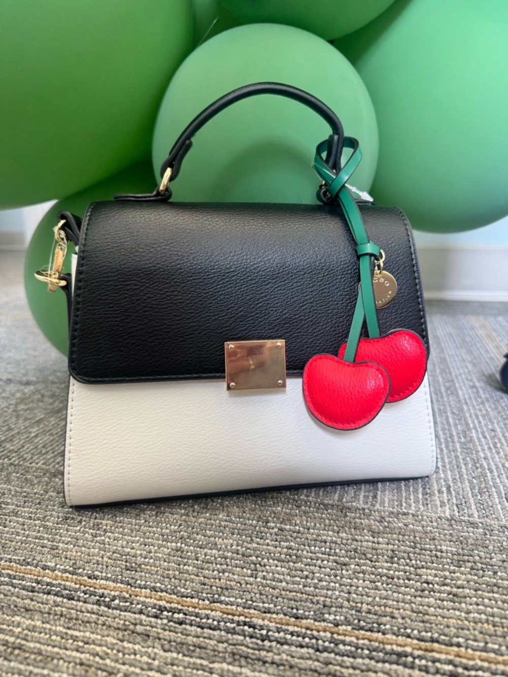 BCBGeneration Black and White Satchel with Red Cherry Charm